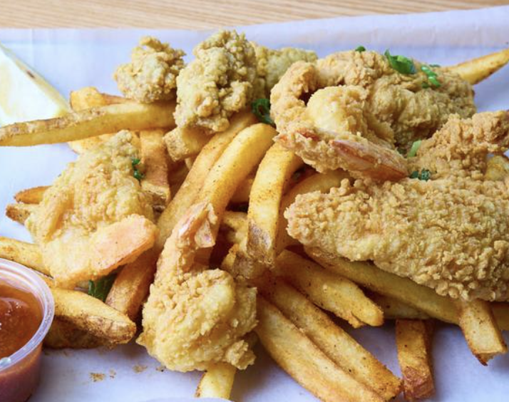 The White Alligator signature dishes Fried Shrimp Po' BoyCajunBeignets